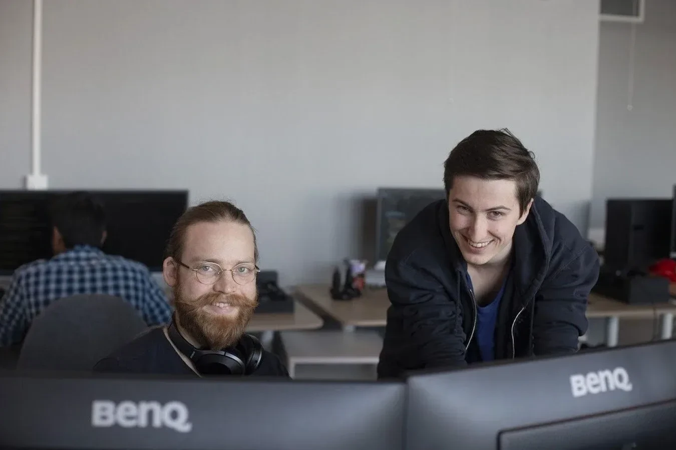 two employees at breach working together on the computer